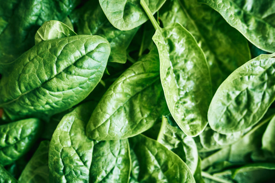 A close-up image of green leafy spinach.