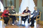 Dearness Home L to R Adult Day Program clients Barb Johnston, Joan Mallard and Carol Howieson enjoy coffee, cookies and fellowship.  With them is Westervelt College personal support student Shelem Turan.  (Derek Ruttan/The London Free Press)