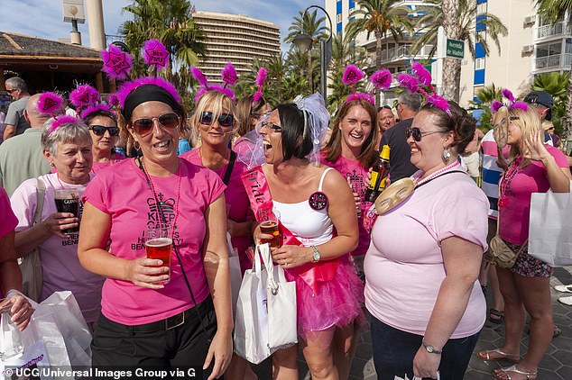 A group of young women are seen on a hen weekend at a seafront bar in Benidorm, Spain - a David Lloyd user said the newcomers are 