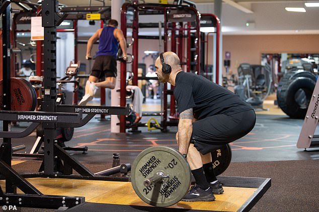 Gym members are seen here working out at a David Lloyd leisure center in Leicester