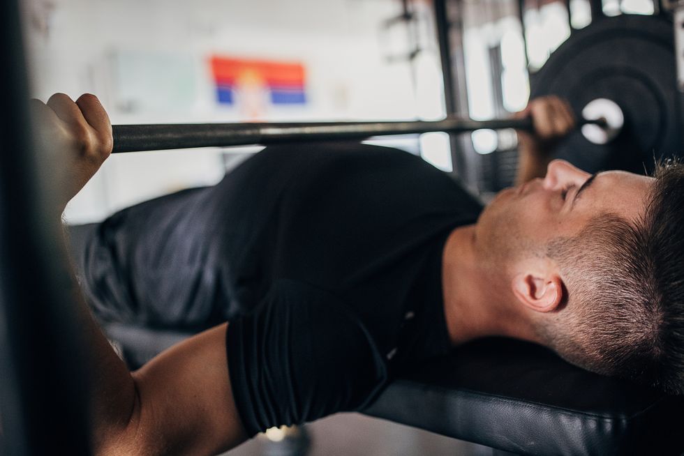 Should we bench press with an arched back?  Here's what the research says