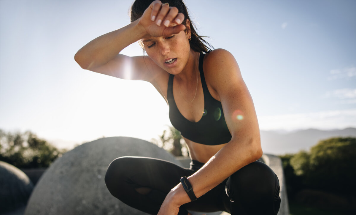 Woman tired and sweaty from long run and training